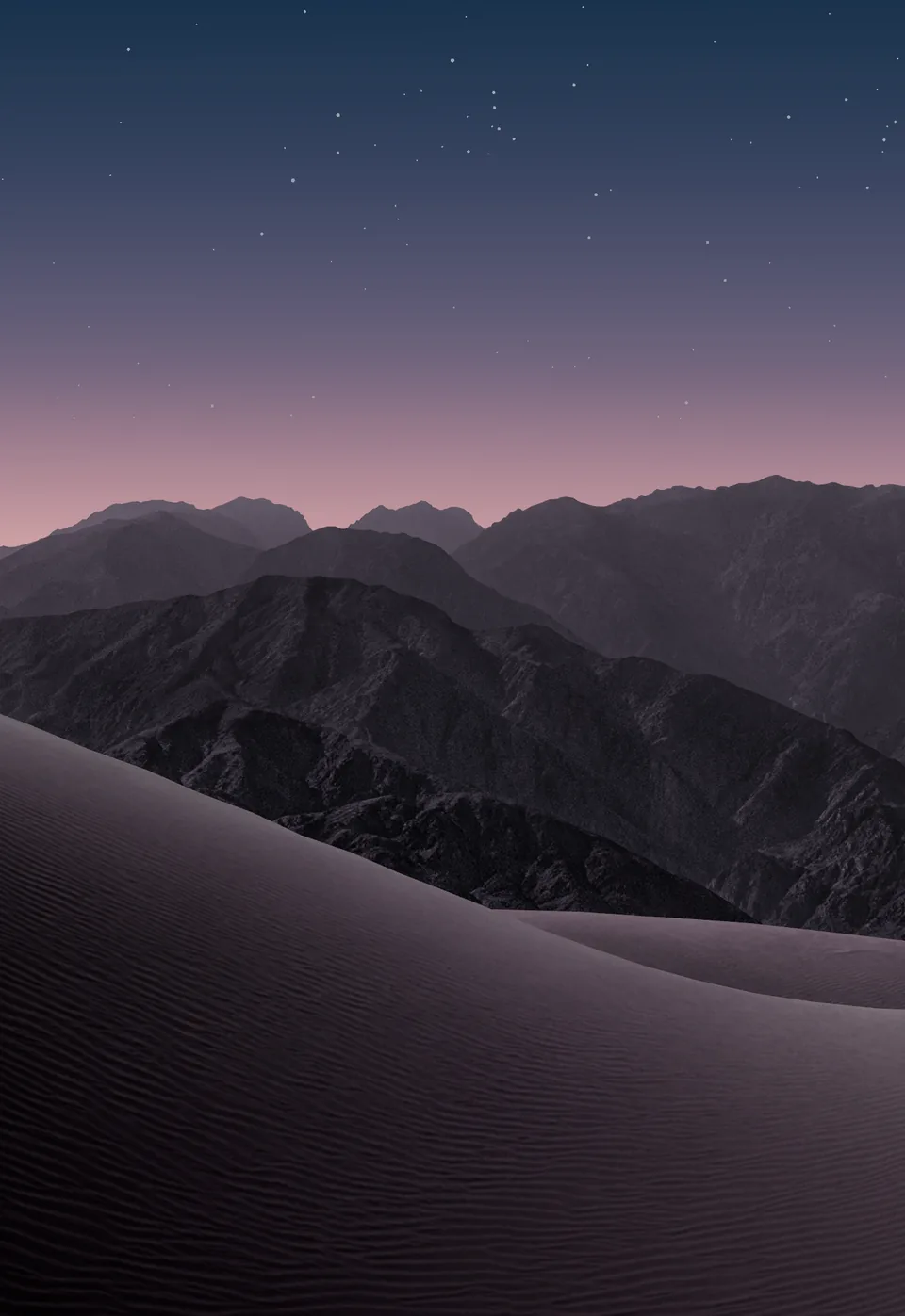 iPhone Duo default outer display Home Screen wallpaper, dark version: violet sand dunes and dark mountains under a starry dusk sky with a pink horizon.